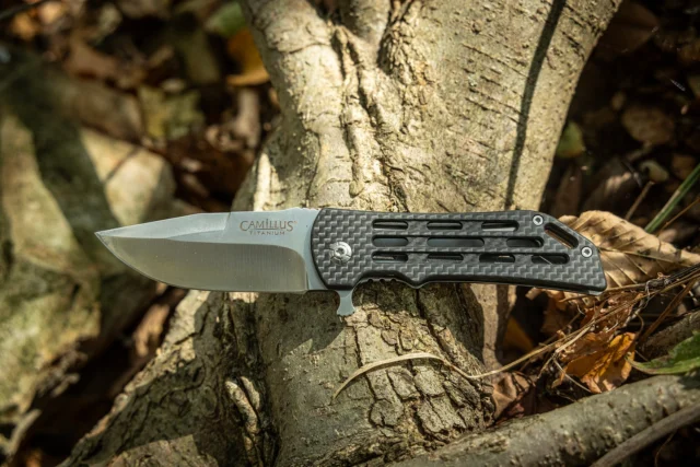The Camillus DOMINATOR II features a Titanium Bonded VG-10 steel blade. VG-10 is considered a "super steel", due to its innate ability to maintain sharpness and durability. Due to its fairly high chromium content as well, VG-10 is also corrosion resistant. The Titanium Bonding provides added corrosion/adhesive resistance, and as a result the stainless steel becomes 3x harder than untreated steel, giving the user a blade that stays sharper for much longer in addition to the aforementioned benefits. The handle reflects the blade's durability and strength, being made of both Carbon Fiber and Stainless Steel to give you a handle that will handle well and cut precisely. Also featuring a pocket clip and lanyard hole for securing your knife, the DOMINATOR II is an essential knife to have in your corner out in the field or during everyday tasks. Don’t miss out—get your DOMINATOR II today!